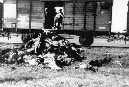Romanians remove corpses from a train carrying Jews deported from Iasi